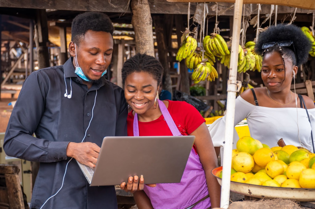 Re- Digital trade, What is Nigeria doing right? 

An image that shows young Nigerians leveraging the digital in a traditional marketplace