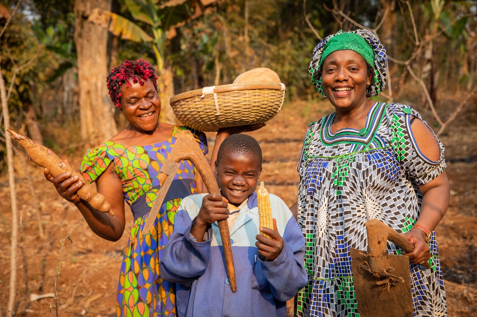 An Image of two women and a child on a farm depicting le miracle Ivoirien